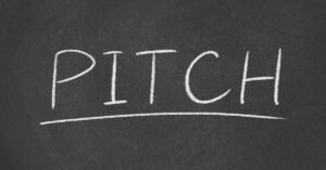 Chalkboard with "PITCH" written in white chalk, symbolizing a business concept.
